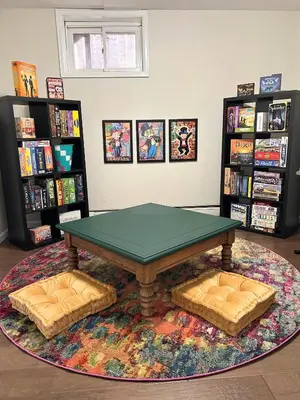 a ping pong table in a room with books at Longmont board games, beds, and boats - 4BR in Longmont