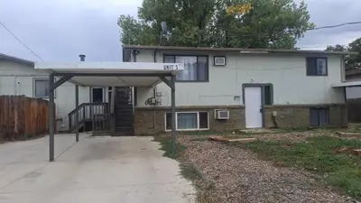 a house with a garage in front of it at Longmont board games, beds, and boats - 2BR in Longmont