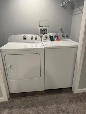 a kitchen with a stove and a washer and dryer at CENTRAL DENVER FAMILY HOMe in Denver