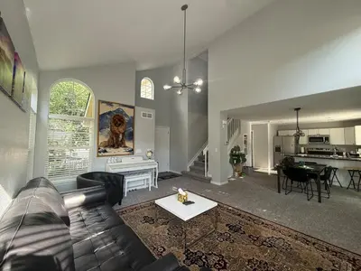 a living room with a couch and a table at CENTRAL DENVER FAMILY HOMe in Denver