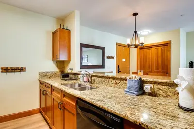 a kitchen with a sink and a counter top at Family Ski Trip! Upscale Keystone Condo Near Lift in Dillon