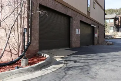 a pair of garage doors on the side of a building at Family Ski Trip! Upscale Keystone Condo Near Lift in Dillon