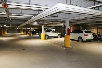 a parking garage with several cars parked in it at Family Ski Trip! Upscale Keystone Condo Near Lift in Dillon