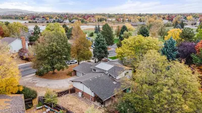 an aerial view of a house with trees at Steps to Lake Mcintosh, Basement 1BR in Longmont