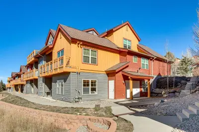 a large house with orange at Walkable Condo 5 Mi to Winter Park Resort! in Fraser