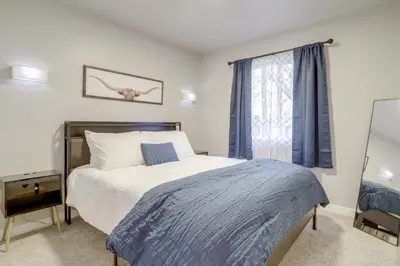 a bedroom with a bed and a window at Modern and Pet-Friendly! Northern Colorado Retreat