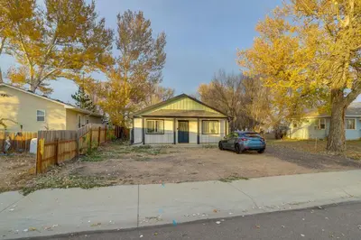 a house with a car parked in a yard at Modern and Pet-Friendly! Northern Colorado Retreat