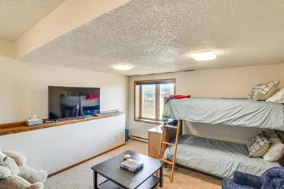 a room with a bunk bed and a tv at Private Sauna! Spacious Ski Condo Near Winter Park in Fraser