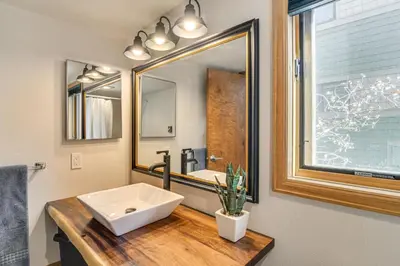 a bathroom with a sink and a mirror at Private Sauna! Spacious Ski Condo Near Winter Park in Fraser
