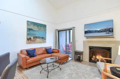 a living room with a couch and a fireplace at Mountainside Aspenview Condo - Great Year-Round Location in Frisco