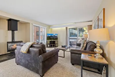 a living room with two couches and a fireplace at Key Condo Slopeside - Walk to Lifts, Pool/Hot Tub, Fantastic Views in Keystone