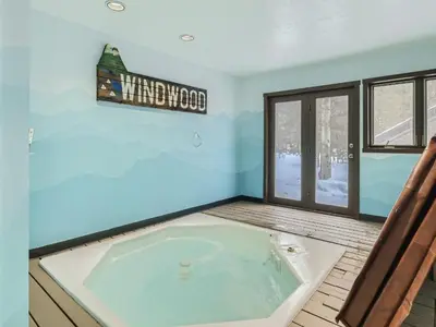 a large jacuzzi tub in a room with a window at Windwood Bluebird Townhome - Walk to Town, Close to Everything in Frisco