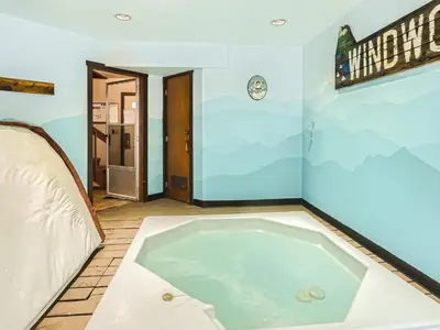a jacuzzi tub in the middle of a room at Windwood Bluebird Townhome - Walk to Town, Close to Everything in Frisco