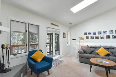 a living room with a couch and a table at Windwood Bluebird Townhome - Walk to Town, Close to Everything in Frisco