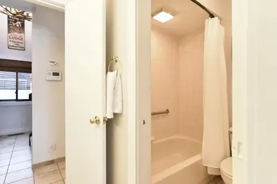 a bathroom with a bath tub and a toilet at Lake Forest Alpine View: Lake Mountain Views in Frisco