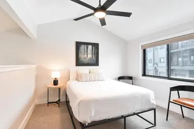 a bedroom with a bed and a ceiling fan at Lake Forest Alpine View: Lake Mountain Views in Frisco