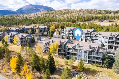 an aerial view of an apartment complex in the mountains at Lake Forest Alpine View: Lake Mountain Views in Frisco