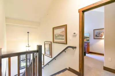 a staircase in a home with a stair case at Red Hawk Townhome - Walk to Lifts, Pool/Hot Tub Access in Keystone