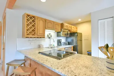 a kitchen with a sink and a counter top at Timber Ridge Retreat - Pool, Hot Tub, Sauna + More in Silverthorne