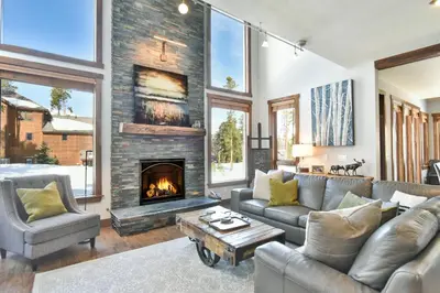 a living room with a couch and a fireplace at Shekel Haus – Luxury Mountain Retreat w/ Views Hot Tub in Breckenridge