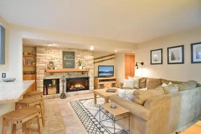 a living room with a couch and a fireplace at Wild Irishman RR Chalet: Fantastic Keystone Getaway in Keystone