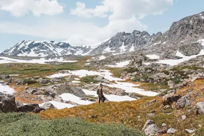 a man standing on top of a snowy mountain at Wild Irishman RR Chalet: Fantastic Keystone Getaway in Keystone