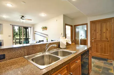 a kitchen with a sink and a counter top at Highland Greens Retreat: Great Location, Near Shuttle Stops in Breckenridge