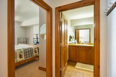 a bathroom with a sink and a mirror at Highland Greens Retreat: Great Location, Near Shuttle Stops in Breckenridge
