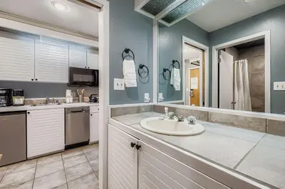 a bathroom with a sink and a large mirror at 2747 Slopeside studio in Keystone