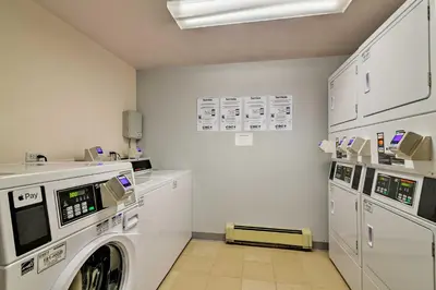 a laundry room with a washer and dryer at Hot Tub Access Condo 2 Mi to Winter Park Resort! in Winter Park