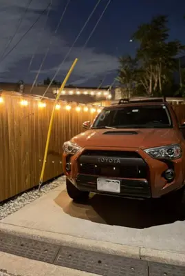 a truck parked next to a fence at night at RiNo Retreat Flat walkable and great location in Denver