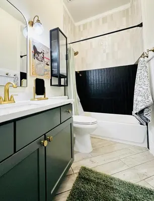 a bathroom with a sink and a toilet and a tub at RiNo Retreat Flat walkable and great location in Denver