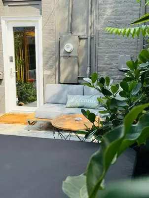 a couch and a coffee table on a patio at RiNo Retreat Flat walkable and great location in Denver