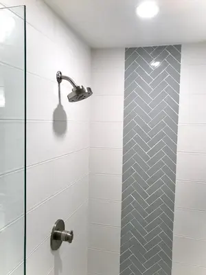 a bathroom with a shower with a glass door at Steps to Lake Fireplace Indoor Outdoor Oasis in Grand Lake