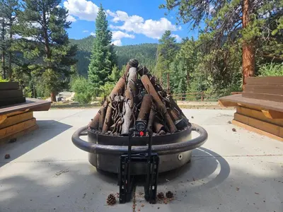 a pile of logsigunigunigunigunigunigunigunigun at Cabin 19- King Studio Gorgeous views Hotel Style in Estes Park