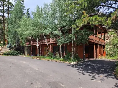 a house on the side of a road at Cabin 21- Accessible Unit & King Bed in Estes Park