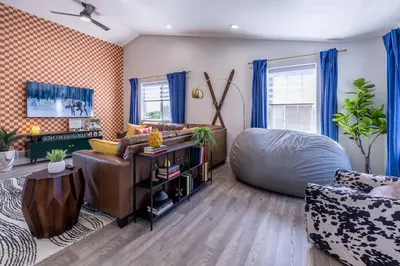 a living room with a bean bag chair and a couch at Hot Tub w Mountain View in Westminster