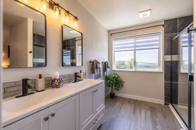a bathroom with a sink and a mirror at Hot Tub w Mountain View in Westminster