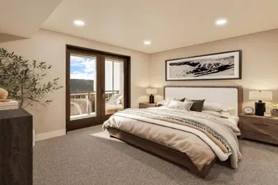 a bedroom with a large bed and a balcony at Kindred Resort Luxury Ski In, Ski Out 3 Bedroom Residence At The River Run Gondola in Dillon