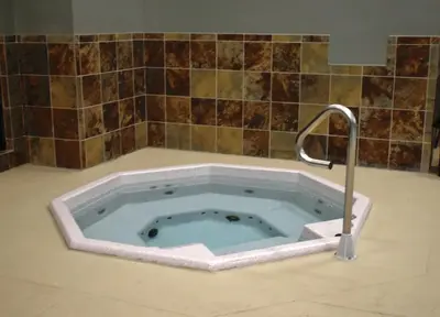 a bath tub with a faucet in a bathroom at Winter Park Condo with Fireplace, Centrally Located in Winter Park
