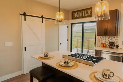 a kitchen with a counter with a stove top oven at Ski Granby Ranch five minutes from the house in Granby