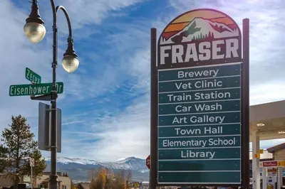 a sign in front of a train station at Charming 2BR Fraser Escape Fireplace Trails Resort Nearby in Fraser