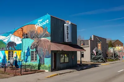 a building with a painting of a deer on it at Charming 2BR Fraser Escape Fireplace Trails Resort Nearby in Fraser