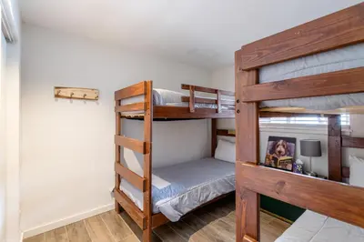 a bunk bed room with two bunk beds at Charming 2BR Fraser Escape Fireplace Trails Resort Nearby in Fraser