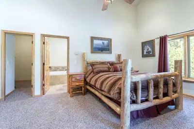 a bedroom with a large bed in a room at Spacious Pet-Friendly Grand Lake House in Grand Lake