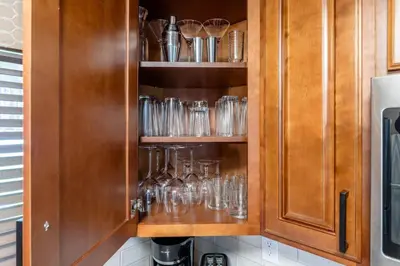 a cupboard with glasses in it at Winter Park Mountain Retreat with Stunning Views in Winter Park