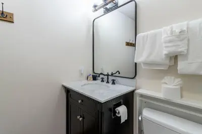 a bathroom with a sink and a mirror at Winter Park Mountain Retreat with Stunning Views in Winter Park