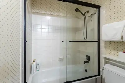 a bathroom with a shower and a bath tub at Winter Park Mountain Retreat with Stunning Views in Winter Park