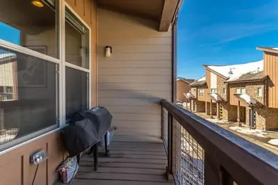 a balcony with a view of a house at Winter Park 3BR Townhouse with Mountain views in Fraser