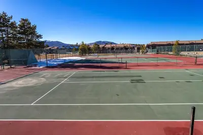 a tennis court with two tennis courts at Fraser 3BR Condo with Pool and Hot Tub in Fraser